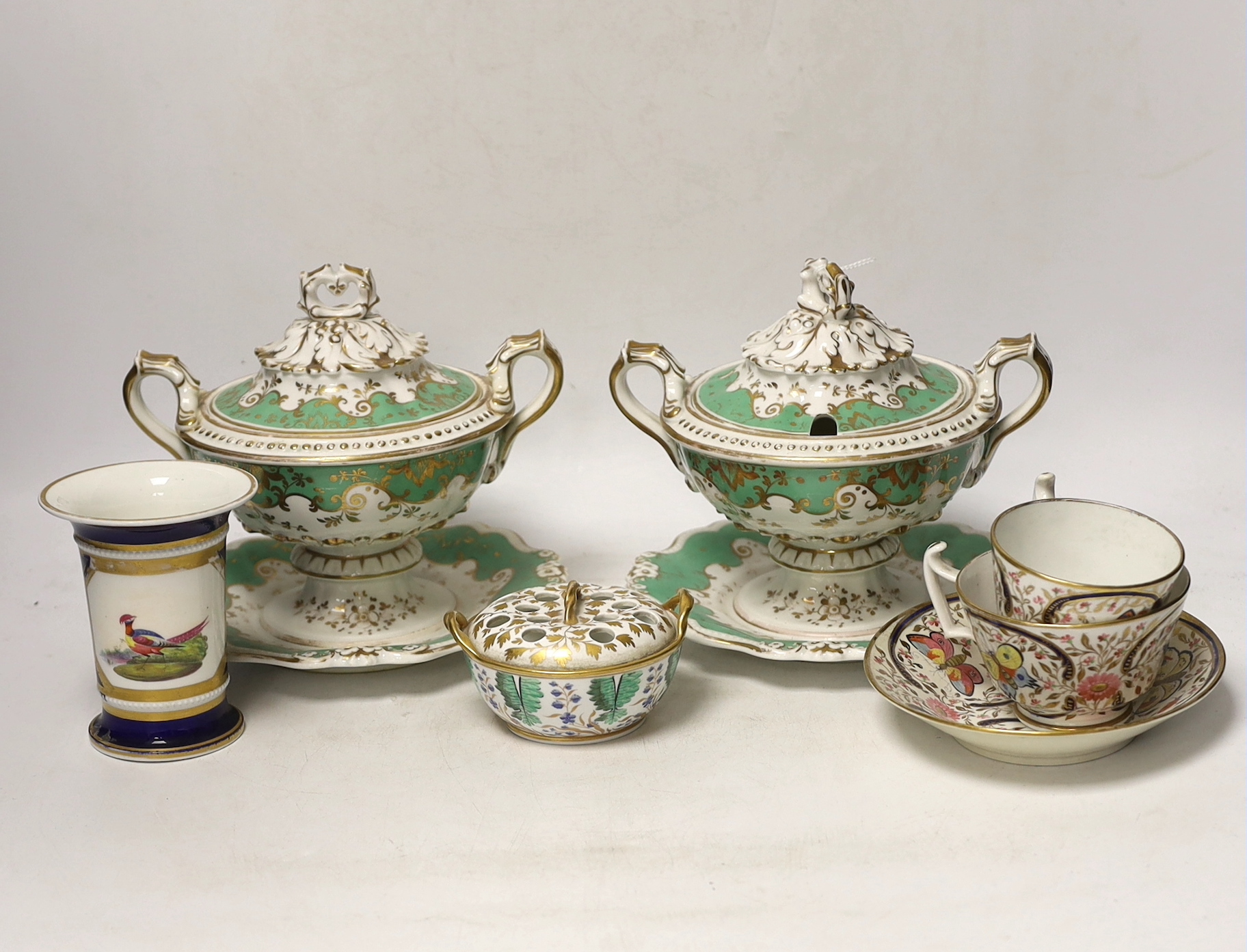 Early 19th century English porcelain including a Wedgwood pot pourri bowl and cover, two sauce tureens covers with integral stands, a butterfly painted trio and a bird painted spill vase